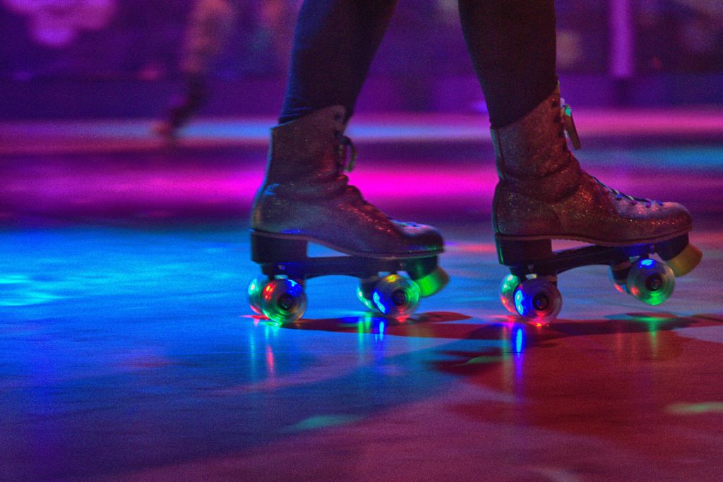 Low Section Of Person Wearing Roller Skates