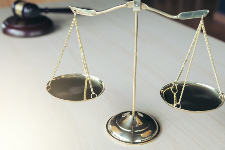 Close-Up Of Weight Scale On Table At Courtroom