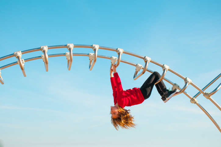 Girl Playing on a Climbing Frame