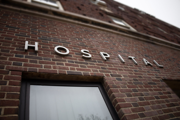 generic hospital sign on brick building facade