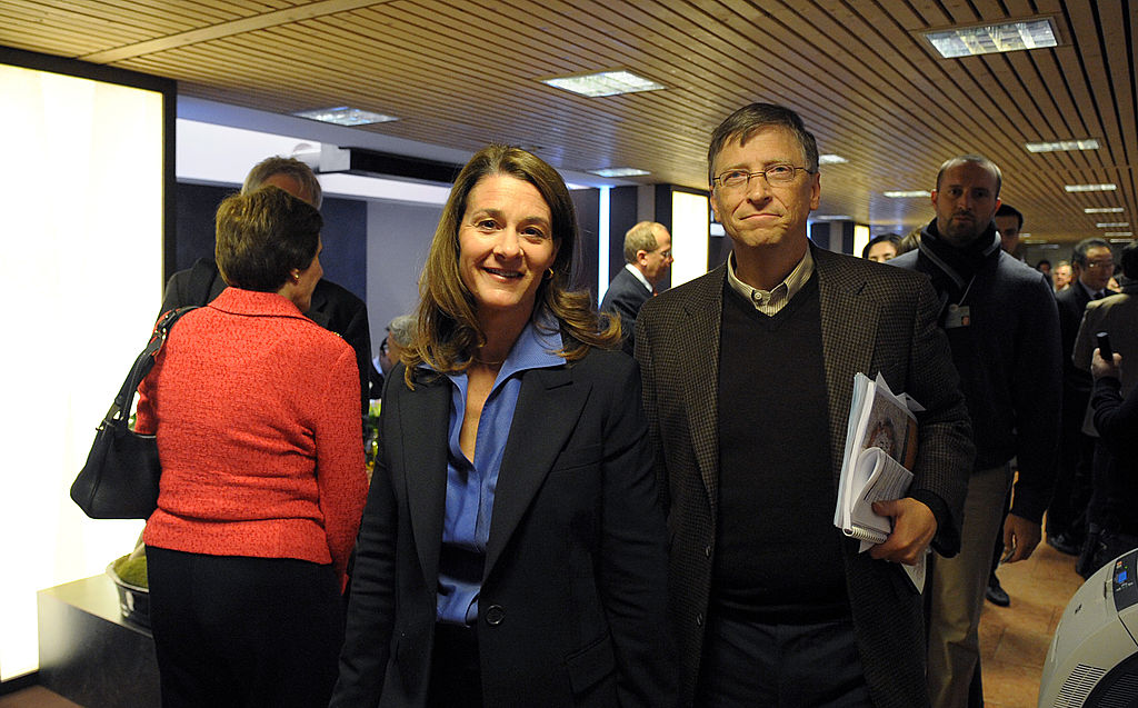 Bill and Melinda Gates walk in the Congr