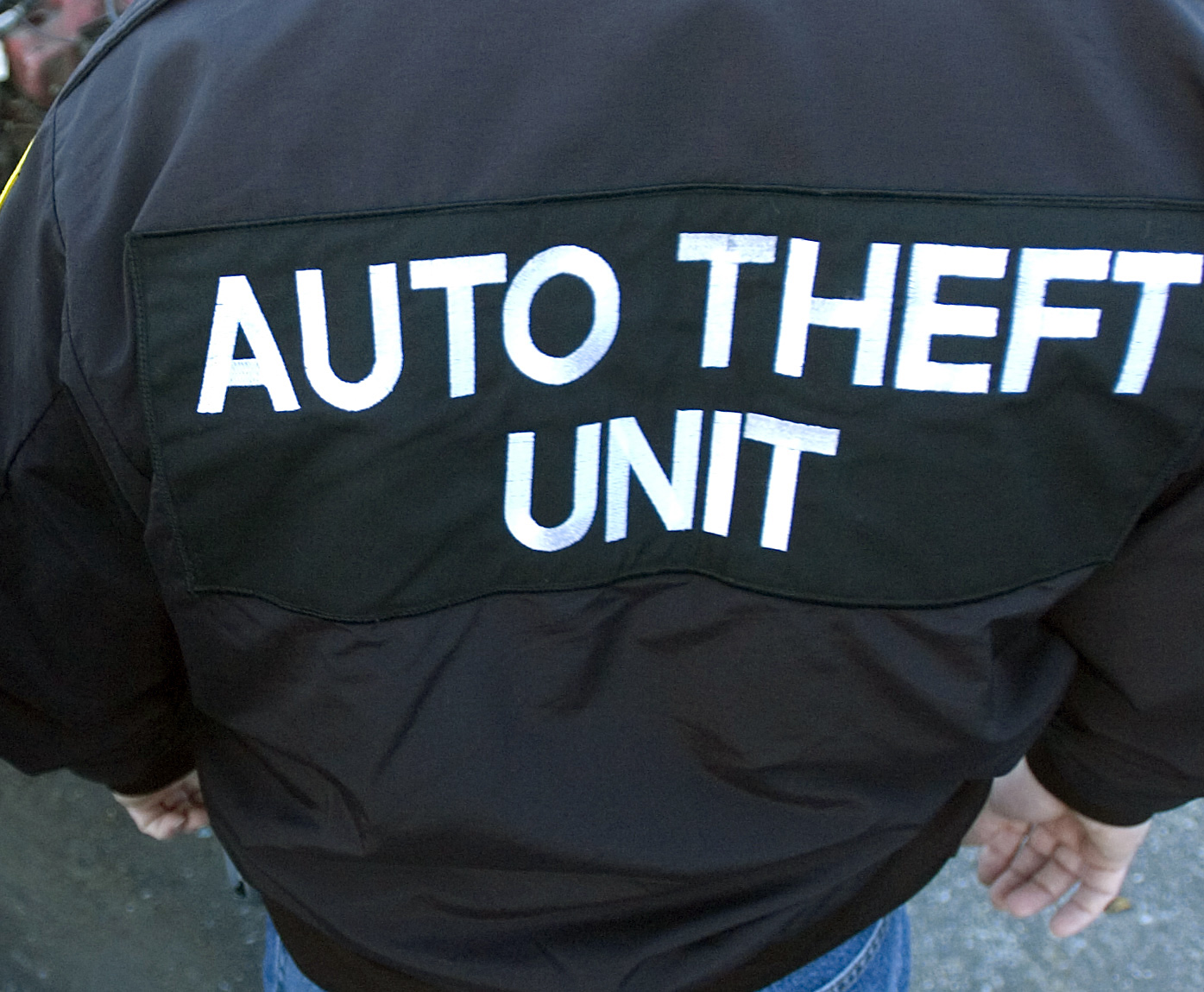 12/12/2007 Reading, PA 200702683Two Reading Police Officers with the Central Pennsylvania unit of the State Police Auto theft task force Wed afternoon next to a car at Vince's towing that had was stolen and stripped.Reading Eagle Photo