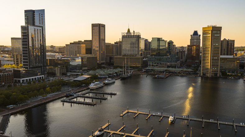 The aerial view of the Inner Harbor on Patapsco River in Baltimore, Maryland, USA, at sunset.