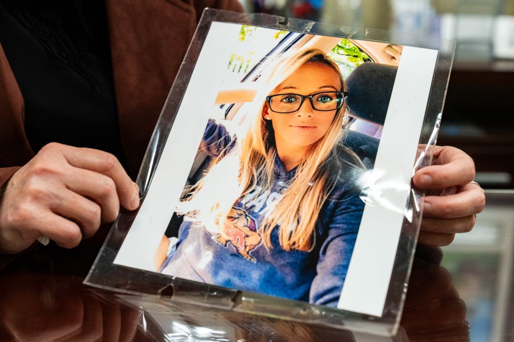 Patty Morin displays a photo of her daughter, Rachel Morin, who was killed last year.
