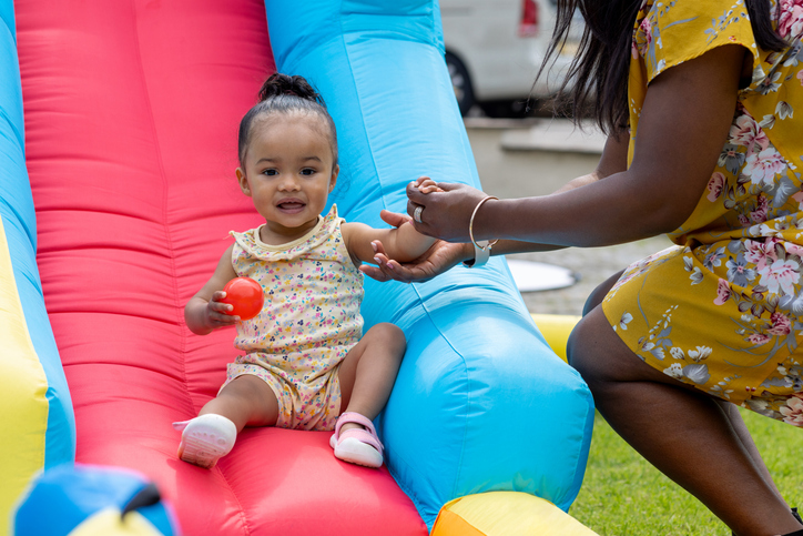 Baby Girl Enjoying the Slide