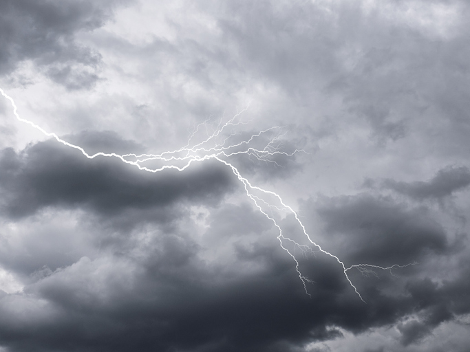 Sky with rain and storm clouds with lightning.